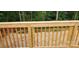 Decking of a wooden deck shows an open design with beautiful nature in the background, providing a relaxing view at 536 Robinhood Rd # 27, Maiden, NC 28650