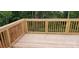Exterior shot of a wooden deck with railings overlooking a wooded backyard at 536 Robinhood Rd # 27, Maiden, NC 28650