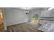 Bright dining room featuring wood floors, deck access and modern light fixture at 536 Robinhood Rd # 27, Maiden, NC 28650