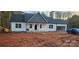 Charming single-story home with white siding, a black roof, and an attached garage at 536 Robinhood Rd # 27, Maiden, NC 28650