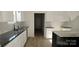 New kitchen with granite countertops, stainless steel sink and wood floors at 536 Robinhood Rd # 27, Maiden, NC 28650