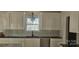 Kitchen featuring black countertops, white cabinets and stainless steel faucet at 536 Robinhood Rd # 27, Maiden, NC 28650
