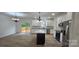Stylish kitchen featuring white cabinets, black countertops, and stainless steel appliances at 536 Robinhood Rd # 27, Maiden, NC 28650
