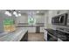 Modern kitchen boasting white cabinets, black countertops, and stainless steel appliances at 536 Robinhood Rd # 27, Maiden, NC 28650