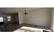 Open concept living room with modern chandelier fixture and durable wood flooring at 536 Robinhood Rd # 27, Maiden, NC 28650