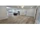 Open-concept living space with a kitchen island and wood-look flooring at 536 Robinhood Rd # 27, Maiden, NC 28650