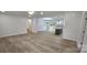 Bright, open-concept living space with hardwood floors leading to a rear patio at 536 Robinhood Rd # 27, Maiden, NC 28650