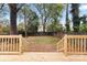 Spacious backyard with wooden deck and fenced perimeter at 1905 Umstead St, Charlotte, NC 28205