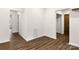 Bright hallway with wood-look floors and access to several rooms at 1905 Umstead St, Charlotte, NC 28205