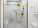 Large walk-in shower with marble tile and built-in seat at 1905 Umstead St, Charlotte, NC 28205