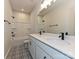 Elegant bathroom featuring double vanity, patterned tile flooring, and bathtub at 5676 Clear Creek Ln, Charlotte, NC 28215