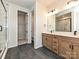 Elegant bathroom featuring a double vanity, tile flooring, and glass enclosed shower at 5676 Clear Creek Ln, Charlotte, NC 28215