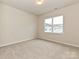 Bright, carpeted bedroom with natural light, perfect for relaxation and rest at 5676 Clear Creek Ln, Charlotte, NC 28215