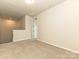 Spacious bedroom with neutral carpet and ample natural light at 5676 Clear Creek Ln, Charlotte, NC 28215