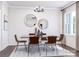 Elegant dining room with stylish decor, contemporary lighting, and a large window at 5676 Clear Creek Ln, Charlotte, NC 28215