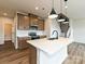 Gourmet kitchen with a large island, stainless steel appliances, and custom cabinetry at 5676 Clear Creek Ln, Charlotte, NC 28215