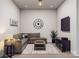 Cozy living room with a comfortable sectional, modern decor, and a large TV at 5676 Clear Creek Ln, Charlotte, NC 28215