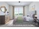Beautifully decorated main bedroom with dresser, rug, and lamps at 5676 Clear Creek Ln, Charlotte, NC 28215