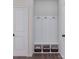 Well-organized mudroom with built-in bench, coat hooks, and storage baskets at 5676 Clear Creek Ln, Charlotte, NC 28215