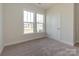 Cozy bedroom with carpet, and a window view of the neighborhood at 7169 Chamberlain Dr, Harrisburg, NC 28075
