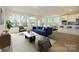 Staged living room with bright light and open space at 7169 Chamberlain Dr, Harrisburg, NC 28075