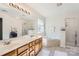 Elegant bathroom with double sinks, soaking tub, and shower at 2240 Dunnwood Hills Dr, Matthews, NC 28105