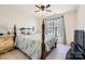 Spacious bedroom with a large window and wood bed frame at 2240 Dunnwood Hills Dr, Matthews, NC 28105