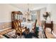 Formal dining room with elegant wood furniture and a chandelier at 2240 Dunnwood Hills Dr, Matthews, NC 28105