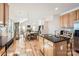 Open kitchen with an island and stainless steel appliances at 2240 Dunnwood Hills Dr, Matthews, NC 28105