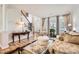 Spacious living room featuring hardwood floors and ample natural light at 2240 Dunnwood Hills Dr, Matthews, NC 28105