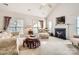 Living room with a fireplace and plenty of natural light at 2240 Dunnwood Hills Dr, Matthews, NC 28105