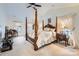 Main bedroom with a large four-poster bed and ample space at 2240 Dunnwood Hills Dr, Matthews, NC 28105