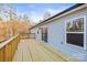 Back deck with space for entertaining and outdoor enjoyment with views of wooded yard at 3146 Captains Cove Ln, Lincolnton, NC 28092