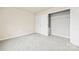 Bedroom featuring neutral carpet and a closet with wire shelving at 3146 Captains Cove Ln, Lincolnton, NC 28092
