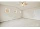 Spacious bedroom has carpeted floors, a ceiling fan, and three windows at 3146 Captains Cove Ln, Lincolnton, NC 28092