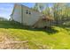 Beautiful home featuring a spacious deck and stairs leading down to a lush green lawn at 3146 Captains Cove Ln, Lincolnton, NC 28092