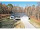 Charming single-story home featuring a two-car garage and welcoming front yard with mature trees at 3146 Captains Cove Ln, Lincolnton, NC 28092