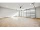 Two-car garage with an automatic door and natural light shining through windows at 3146 Captains Cove Ln, Lincolnton, NC 28092