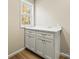 Bright laundry room with white cabinets and a marble countertop at 3146 Captains Cove Ln, Lincolnton, NC 28092