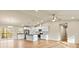 Bright, open-concept living space with wood floors and kitchen with granite countertop island at 3146 Captains Cove Ln, Lincolnton, NC 28092