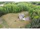An aerial view of a home with a long driveway and lush lawns and mature trees at 3678 Rankin Rd, Concord, NC 28027