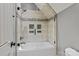 This bathroom offers a shower-tub combo with custom tile surround and modern showerhead at 3678 Rankin Rd, Concord, NC 28027
