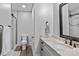 This bathroom has a marble vanity, modern fixtures, and frameless glass shower enclosure at 3678 Rankin Rd, Concord, NC 28027