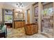This bathroom features a wooden bathtub, wood cabinetry, and travertine floors plus access to shower at 3678 Rankin Rd, Concord, NC 28027