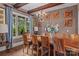 Dining room with a rustic wood table, chandelier, large window, and views of the landscaped yard at 3678 Rankin Rd, Concord, NC 28027