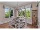 Bright dining area with wooded views from three large windows at 3678 Rankin Rd, Concord, NC 28027