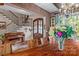 A grand dining room featuring a solid wood table, chandelier, and view of the front foyer at 3678 Rankin Rd, Concord, NC 28027
