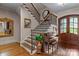 Elegant foyer with a grand staircase, hardwood floors, and a beautiful front door at 3678 Rankin Rd, Concord, NC 28027