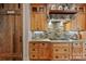 Chef's kitchen features wood cabinets, a pantry door, a gas cooktop, and custom backsplash at 3678 Rankin Rd, Concord, NC 28027