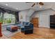 This comfortable living room provides stylish seating, hardwood floors, and natural light at 3678 Rankin Rd, Concord, NC 28027